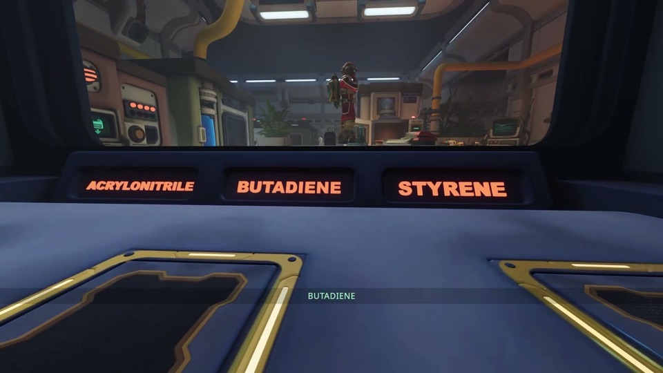 Inside the chamber: orange labels ACRYLONITRILE, BUTADIENE, STYRENE above the floor pads, with the red explorer visible through the window