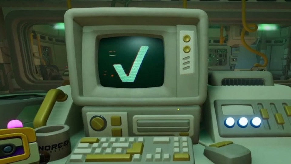 The desk monitor showing a big white check mark with all three blue buttons lit