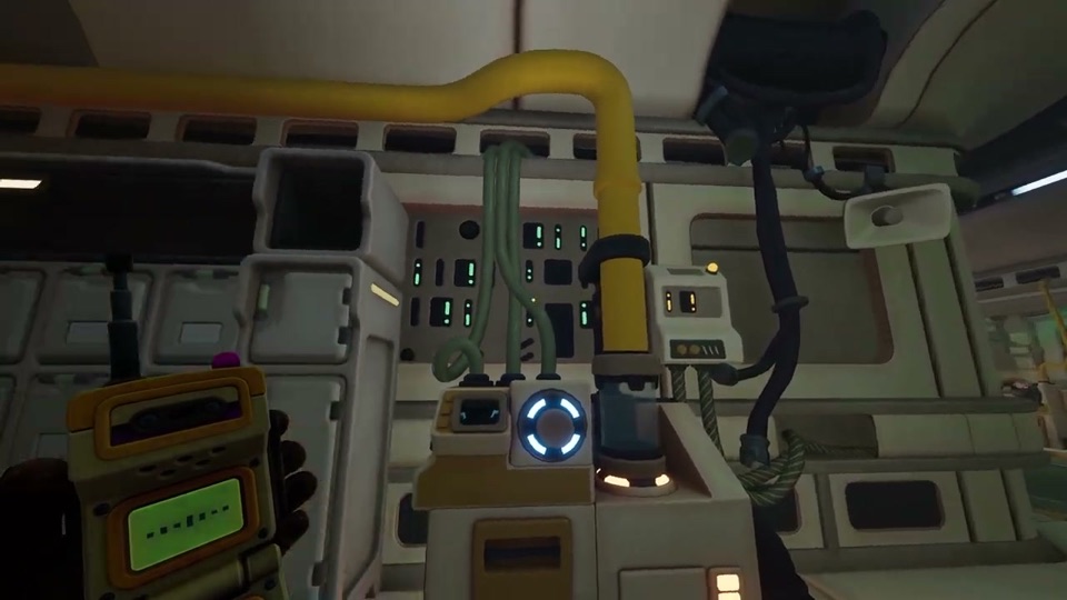A round blue-lit socket under a yellow pipe in the Logistics room, where the canister arrives